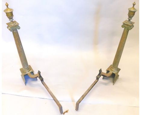 A pair of 19thC brass fire dogs or andirons, each cast in the form of an Ionic type column, with finial, 72cm high