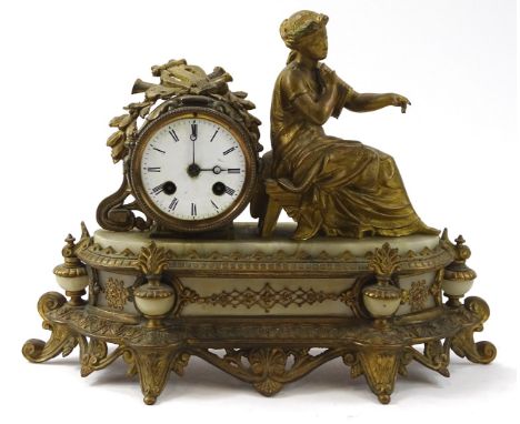 A late 19thC gilt metal marble and enamel mantel timepiece, the 8cm diameter Roman numeric dial aside a figure of a seated la