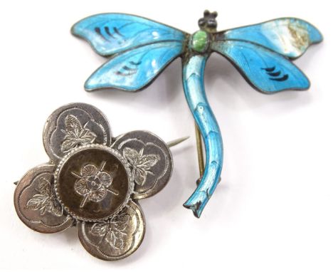 Two brooches, to include a silver floral brooch with engraved flower and leaf design, a silver dragonfly enamel brooch, marke