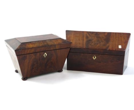 A 20thC mahogany box, of shaped outline with plain interior and flame mahogany sarcophagus shaped tea caddy with diamond escu