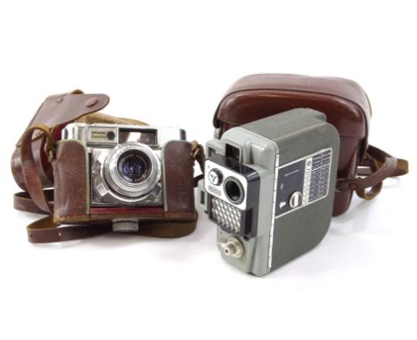 A Eumig camera, and another Braun Paxette with Schneider-Kreuznach 1:2.8/50 5522187 lense in leather case, 12cm high. (2)