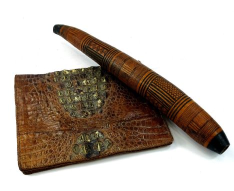 An early 20thC alligator skin pouch, 42cm wide, an African tribal item. (2)