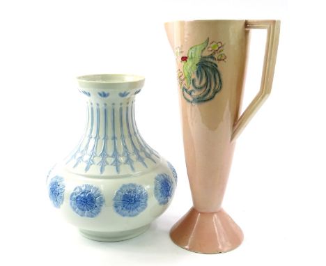 A Nao vase, decorated with an upper acanthus style banding with further floral rosette in blue on a white ground, on circular