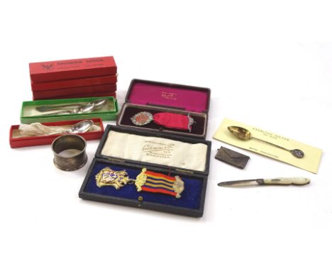 A collection of items, to include Sterling silver commemorative spoons, fruit knife with mother of pearl handle, bowls, spoon