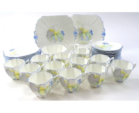 A Shelley part tea service, decorated with a sunlit scene of a gate, blue iris etc., within a blue border, registration numbe