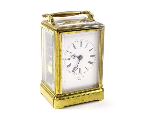 A French brass carriage clock, the enamel dial signed Raingo Paris, 10cm high.