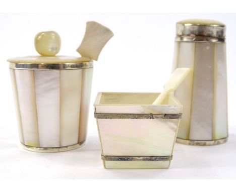 A mother of pearl white metal preserve set, to include salt pot 9cm high, shaped spoon etc. (a quantity)