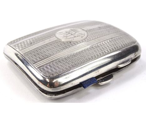 A George V silver cigarette case, of curved oblong outline, partially engine turned with initialled central cartouche and par