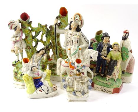 Various 19thC and later Staffordshire figures, to include spill vase set with figures with sparse decorated, 16cm high, later