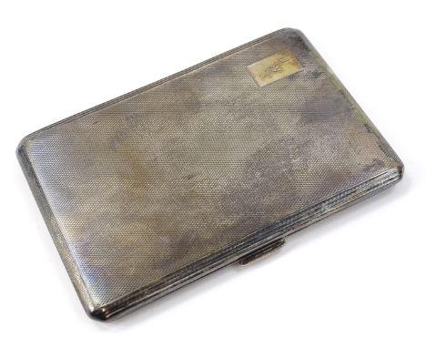 A George V silver cigarette case, of canted rectangular outline, partially engine turned with initial cartouche and part fitt