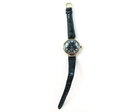 A first quarter of the 20thC 9ct rose gold gentleman's trench style wristwatch, having black dial with Arabic numerals, minut