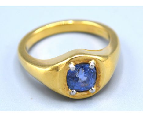 An 18ct. Gold Signet Ring set with a 2ct. pale blue Ceylon sapphire, claw set, 16.3 gms, ring size T complete with valuation 