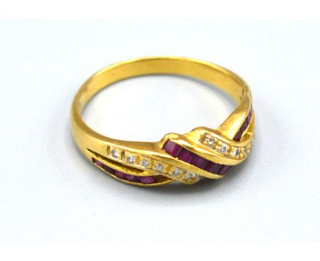 A Yellow Metal Ruby And Diamond Set Ring of crossover form, 2.5gms. ring size M 