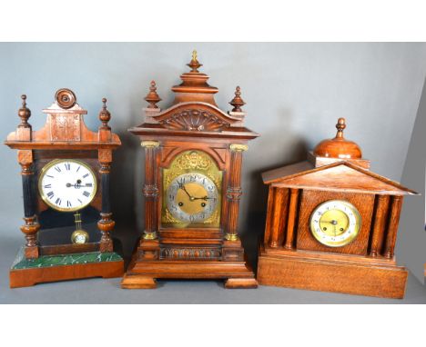 A Victorian Mantle Clock, the silvered dial with Arabic numerals and two train movement, 56cms tall together with two other m