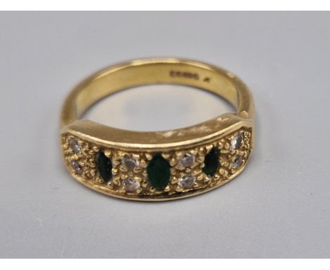 A 9ct gold Emerald and diamond ring set with three emeralds and eight diamonds, ring size L, 4.5 grams 