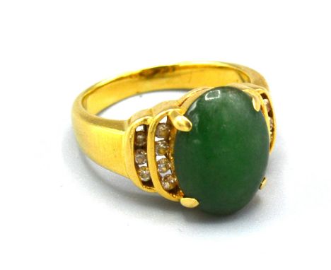 An 18ct. Gold Diamond And Jade Set Dress Ring, 6.6gms. ring size K 