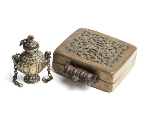 TWO HIMALAYAN CONTAINERS, 19TH CENTURY, comprising a Tibetan copper amulet box with brass overlaid scrollwork design, and a N