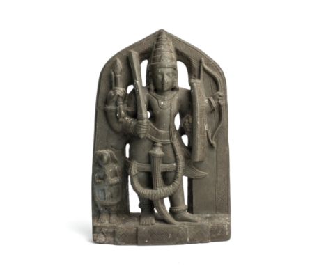 A GREY STONE IMAGE OF VIRABHADRA, DECCAN, INDIA, CIRCA 15TH CENTURY, the four-armed deity holding sword and shield in his pri