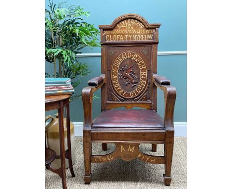 EISTEDDFOD ARM CHAIR, Welsh, 1917, carved, painted and inlaid oak, oval to back with rampant dragon and inscribed 'Y DDRAIG C