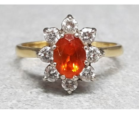 18ct yellow gold Fire Opal ring surrounded by 8 brilliant cut diamonds, size N, 4.1g