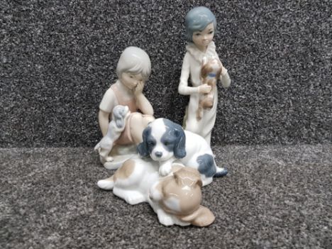 Nao by Lladro figure playing puppies plus 2 other Spanish figures of children 1 by cascades
