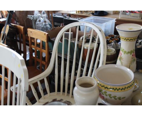 A white painted stick back rocking chair