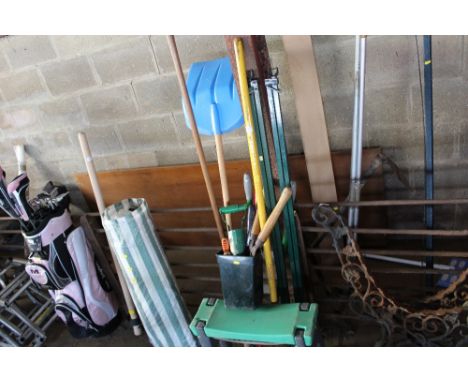 A quantity of long handled gardening tools etc.