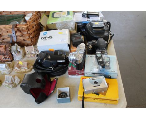 A quantity of various cameras to include Fujifilm digital camera; Polaroid camera etc