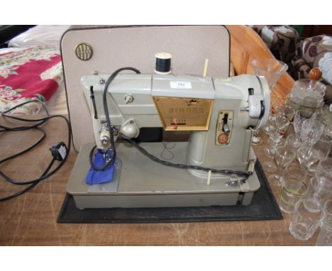 A Singer sewing machine (sold as collectors item)