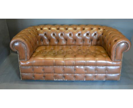 A Beige Leather Button Upholstered Chesterfield Type Sofa, 175 cms wide, 90 cms deep, 70 cms high 