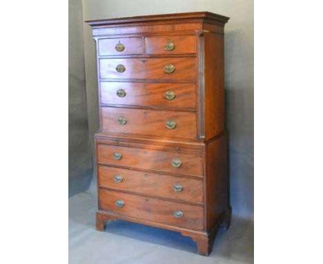 A 19th Century Mahogany Chest on Chest, the moulded cornice above two short and three long drawers, the lower section with a 