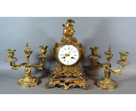 A French Three Piece Clock Garniture, the clock with enamel dial with Arabic and Roman numerals and with two train movement w