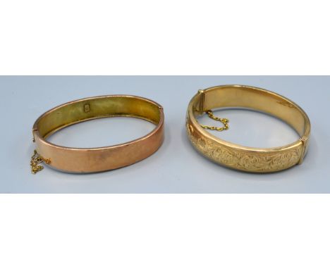 A 9ct. Gold Engraved Bangle together with another similar plain 9ct. gold bangle, 30.5 gms. 