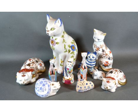 A Royal Worcester Porcelain Model of a Cat decorated in the Imari Palette together with a pair of Hungarian models of cats an