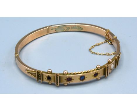 A 9ct. Gold Bangle set stones 9 gms. 