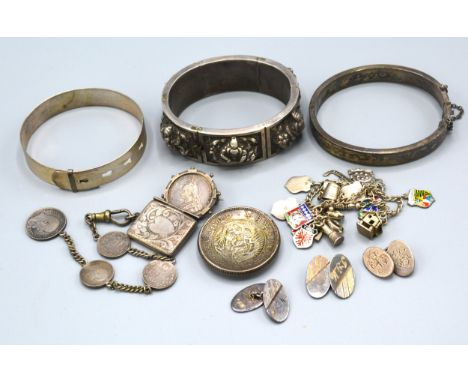 A silver charm bracelet together with an Indian bangle and other related items 