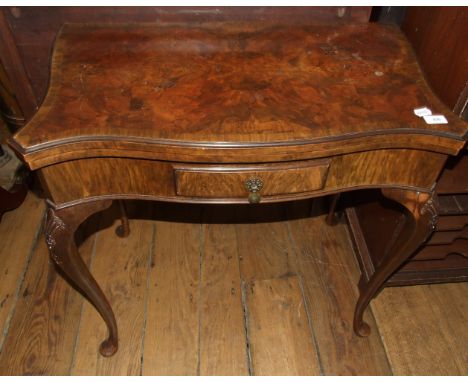 An 18th century style walnut serpentine front card table, on cabriole legs with pad feet, 77 cm wide