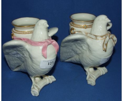 A Worcester porcelain vase, in the form of a dove, with painted and gilt decoration, 15 cm high, and another (2)