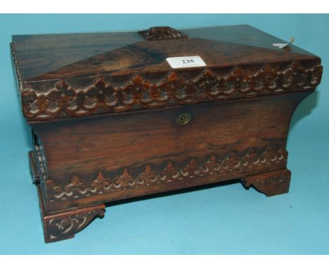 A Victorian rosewood tea caddy, of sarcophagus form, with Gothic style carved decoration, 33 cm wide   Condition report Repor