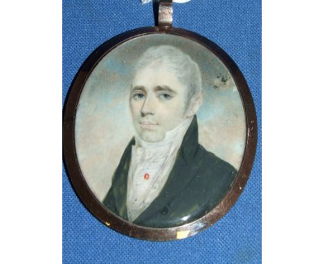 An oval bust portrait miniature, of a gentleman with a coral stick pin, watercolour, 6 x 5 cm Condition report Report by NG

