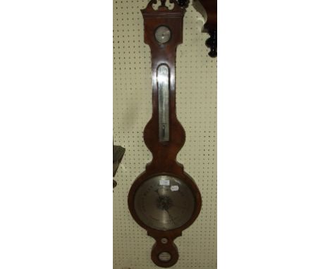 A wheel barometer, with themometer, level and dry/change dial, in a mahogany case, 112 cm high