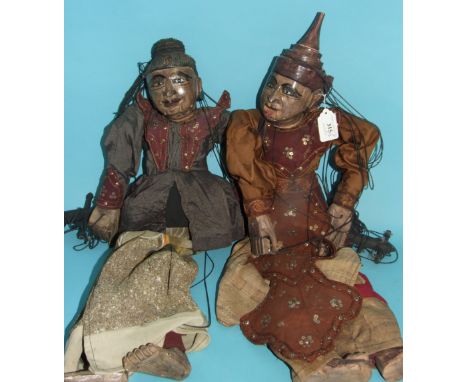 A Burmese style puppet, 61 cm high, and another similar, 64 cm high (2)