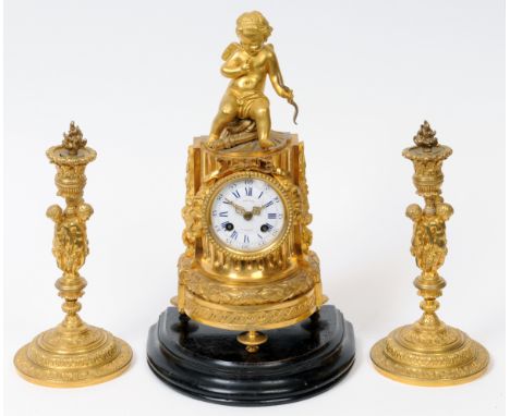 A French clock garniture, the mantel clock dial signed Berger A Paris, fitted an eight day movement, in a gilt metal case, ap