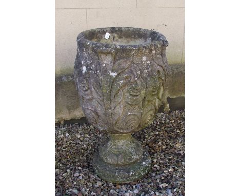 A reconstituted stone garden urn, 68.5 cm high