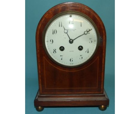A mantel clock, the dial with singed Hampton & Sons Pall Mall East London, in an inlaid mahogany case, 24 cm high Condition r