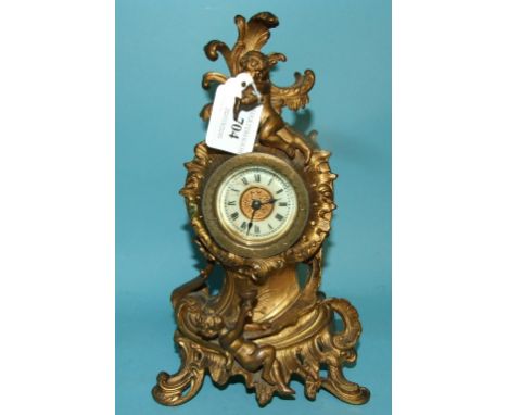 A mantel clock, in a gilt metal case, 25 cm high