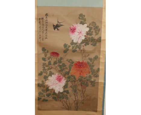 A Chinese painted scroll, decorated a bird amongst flowers and foliage, 173 cm high (overall)