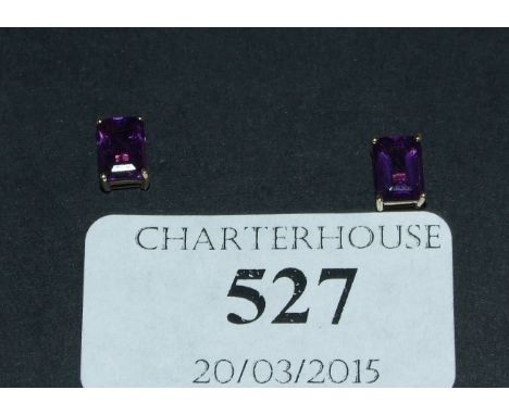 A pair of 9ct gold and amethyst stud earrings