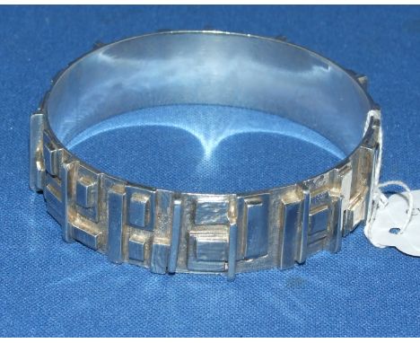 A silver bangle, of geometric design, Graham Watling, London 1975, boxed