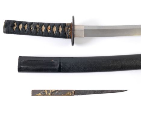 A Japanese wakizashi, unsigned, with a silver inlaid iron tsuba, cord bound fishskin grip, and lacquered scabbard, with knife